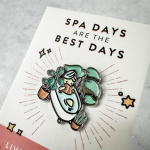 Fab Spa Life Enamel Pin - Limited Edition | Lucky Owl depicting a relaxing bathtub scene with plants and spa elements, emphasizing wellness and self-care.