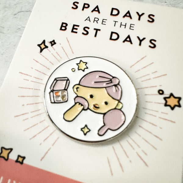 Fab Spa Life Enamel Pin - Limited Edition | Lucky Owl featuring a cute character with a towel wrapped on its head, holding a mirror and makeup palette, celebrating spa days.
