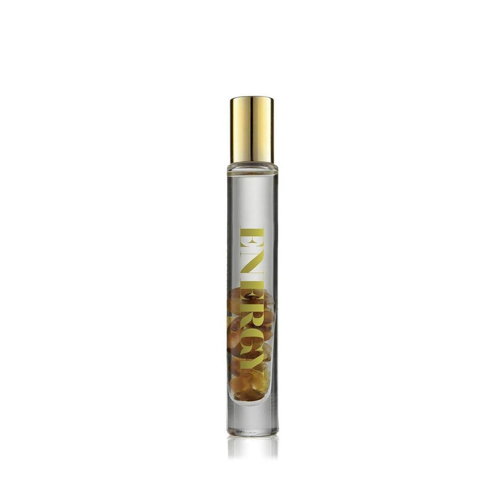 Energy Rollerball | Aluminate Life featuring a clear glass rollerball bottle with golden cap and red carnelian crystals inside, next to sleek branded packaging for wellness use.