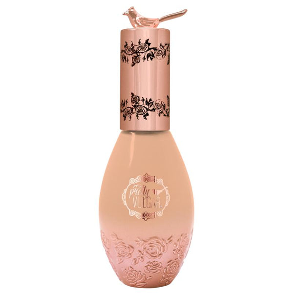 Elegant bottle of Cool AF Lava Water Foundation | Pretty Vulgar with rose gold floral embossed design and a small bird detail on the cap, showcasing premium skincare packaging.