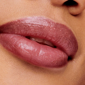 Close-up of lips wearing Hydropure Hyaluronic Lip Gloss | Jane Iredale in a glossy, natural rose shade with a smooth, moisturizing finish enhancing lip softness.