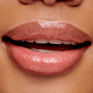 Close-up of lips wearing glossy, natural-toned lip gloss showcasing smooth, hydrated texture with subtle shimmer, highlighting Hydropure Hyaluronic Lip Gloss | Jane Iredale.