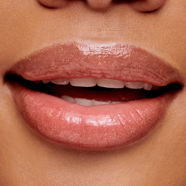 Close-up of lips wearing glossy, natural-toned lip gloss showcasing smooth, hydrated texture with subtle shimmer, highlighting Hydropure Hyaluronic Lip Gloss | Jane Iredale.