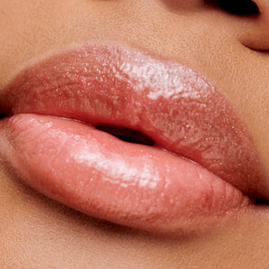 Close-up of lips wearing Hydropure Hyaluronic Lip Gloss | Jane Iredale in a smooth, glossy peach shade highlighting hydration and natural shine.