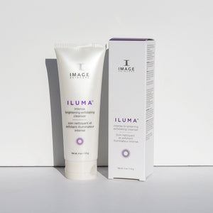 Tube and box of ILUMA intense brightening exfoliating cleanser | IMAGE Skincare displayed on a white surface with soft shadows, emphasizing skincare and wellness.