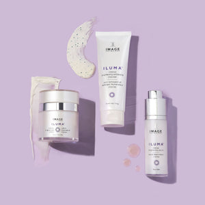 Set of IMAGE Skincare products including ILUMA intense brightening crème | IMAGE Skincare, cleanser, and serum on a lavender background with product textures displayed.