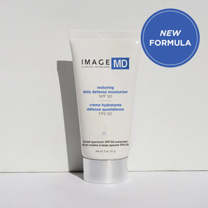 Tube of Restoring Daily Defense Moisturizer SPF 50 | IMAGE Skincare with broad spectrum sunscreen, displayed against a neutral background with a "New Formula" badge.