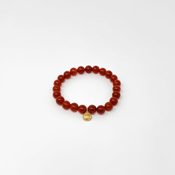 Assorted Satya Bracelets | Satya featuring a single-strand polished red bead design with a small gold charm, perfect for wellness and mindful style.