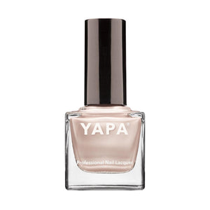 Bottle of Jennifer Nail Lacquer | YAPA in a soft nude shade with sleek black cap designed for professional nail care and beauty.