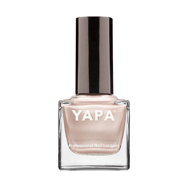 Bottle of Jennifer Nail Lacquer | YAPA in a soft nude shade with sleek black cap designed for professional nail care and beauty.