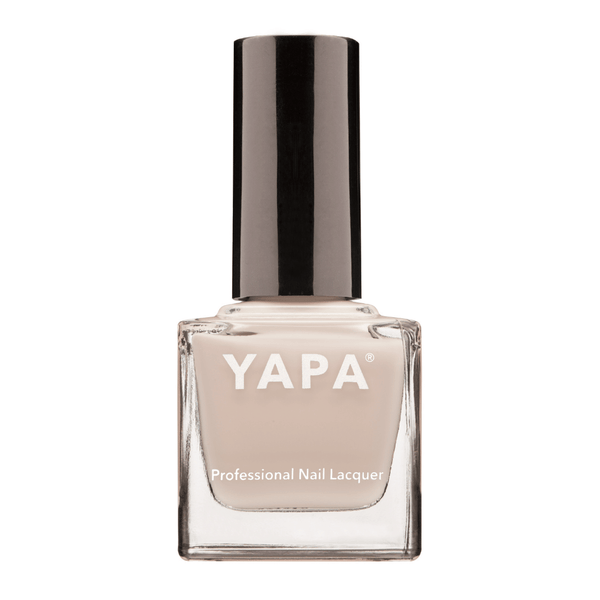 Lauren Nail Lacquer | YAPA in a sleek clear glass bottle with a soft beige nail polish shade and a shiny black cap, ideal for professional nail care and styling.