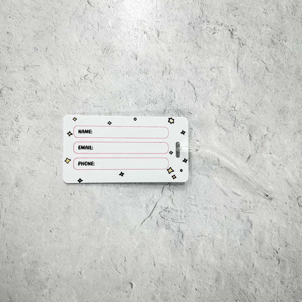 Luggage Tag - Meditating Fox- Limited Edition | Lucky Owl showing the white label side with fields for name, email, and phone on a textured grey background.