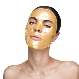 Woman wearing a shiny gold facial sheet mask on a clean white background, showcasing Nanogold Repair Face Mask - 4 Pack | Knesko for skincare and wellness.