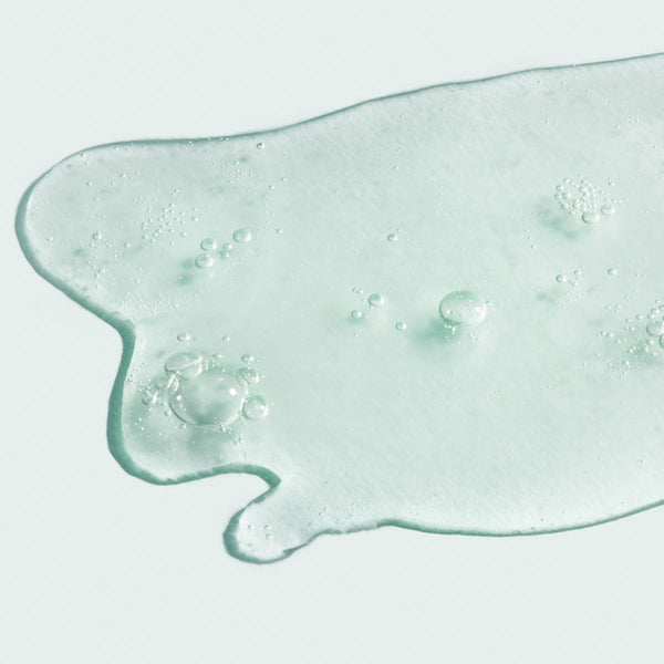 Clear gel texture with small air bubbles representing the lightweight consistency of ORMEDIC balancing antioxidant serum | IMAGE Skincare for skincare and wellness.