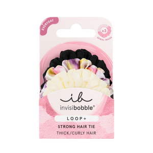 Package of LOOP 3 pc | invisibobble strong hair ties for thick and curly hair in black, tie-dye, and cream colors displayed on a pink and white card.