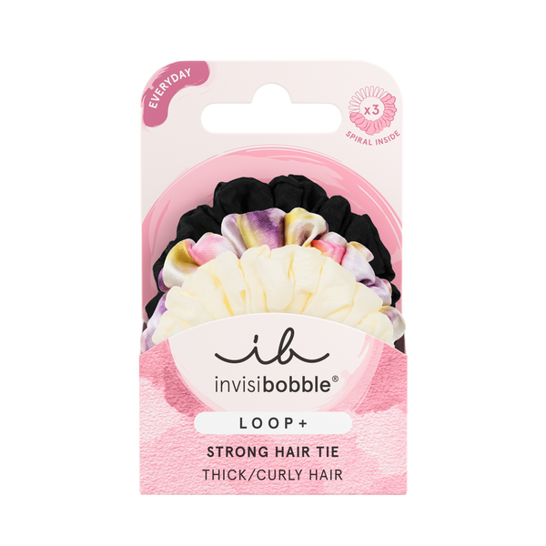 Package of LOOP 3 pc | invisibobble strong hair ties for thick and curly hair in black, tie-dye, and cream colors displayed on a pink and white card.