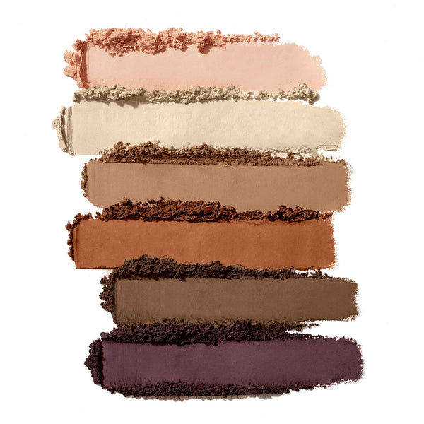 Smudged swatches of neutral to deep earthy tones eyeshadows in a gradient from light beige to dark plum showcasing Purepressed Eye Shadow Palette | Jane Iredale.
