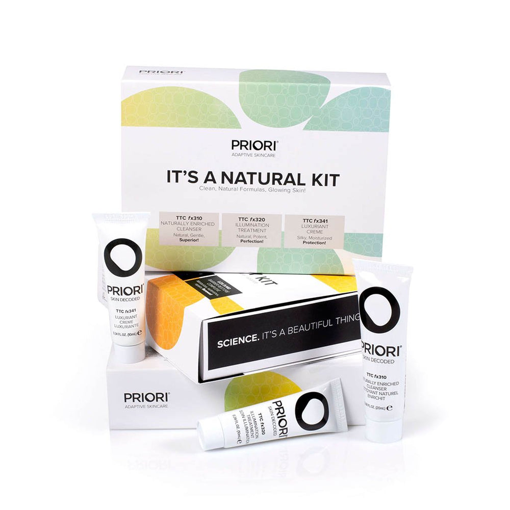 Set of natural skincare tubes and box labeled It’s A Natural Kit | Priori Skincare featuring clean, natural formulas for glowing skin in a minimalist design.