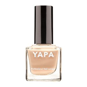 Bottle of Rachel Nail Lacquer | YAPA in a soft nude beige shade with a black cap, designed for professional-quality nail care and beauty.