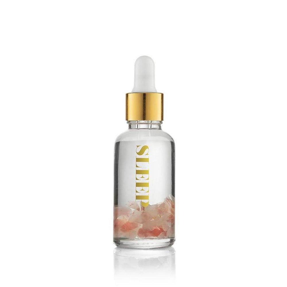 Sleep Essential Oil Vial | Aluminate Life featuring a dropper bottle with rose quartz crystal-infused essential oil blend designed to promote relaxation and wellness.