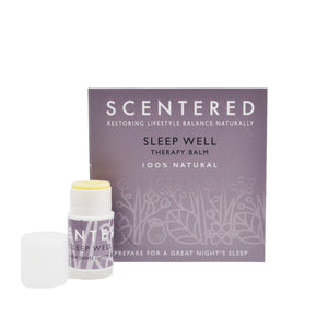 Sleep Well Mini Aromatherapy Balm | Scentered with natural therapy balm stick in front of purple packaging promoting relaxation and a restful night's sleep.