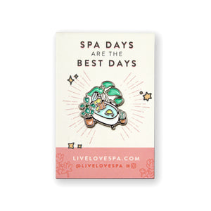 Fab Spa Life Enamel Pin - Limited Edition | Lucky Owl displayed on a card reading "Spa days are the best days," featuring a colorful spa scene with plants and a bath.