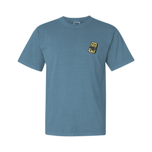 Light blue comfortable tee featuring a small graphic of a lounging bear on the chest, showcasing the Lounging Spa Bear Comfy Tee | Lucky Owl design.
