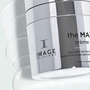 Close-up of the MAX™ crème | IMAGE Skincare jar with a smooth white cream texture in the background, highlighting a premium skincare product.