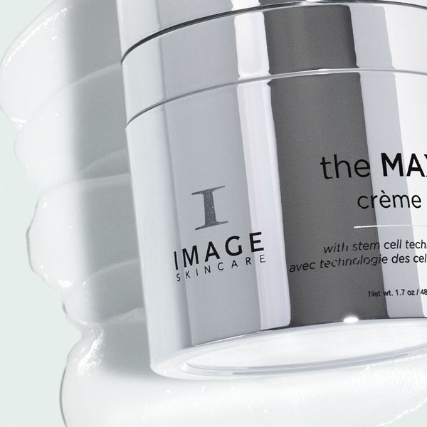 Close-up of the MAX™ crème | IMAGE Skincare jar with a smooth white cream texture in the background, highlighting a premium skincare product.