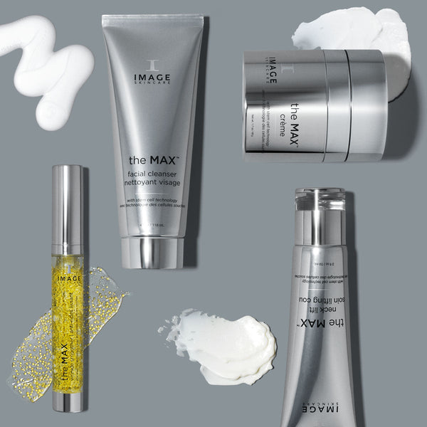 Silver and clear skincare containers from the MAX™ crème | IMAGE Skincare set displayed with product swatches on a gray surface for skincare and wellness supplements.