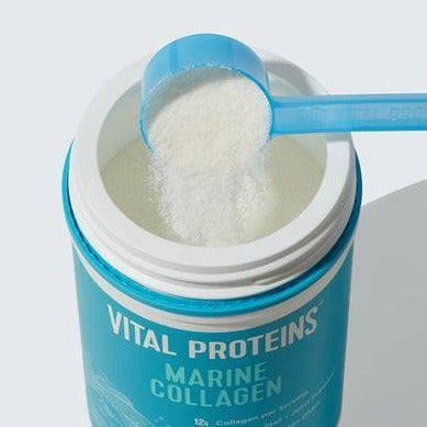 Open container of Marine Collagen - Unflavored | Vital Proteins with a blue scoop filled with white collagen powder above it, representing a wellness supplement for skincare and body care.
