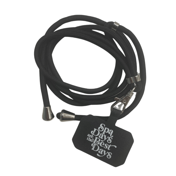 Crossbody Phone Lanyard With Adjustable Strap | Live Love Spa featuring a black adjustable cord and a tag with the phrase "Spa days are the best days" for convenient hands-free phone carrying.