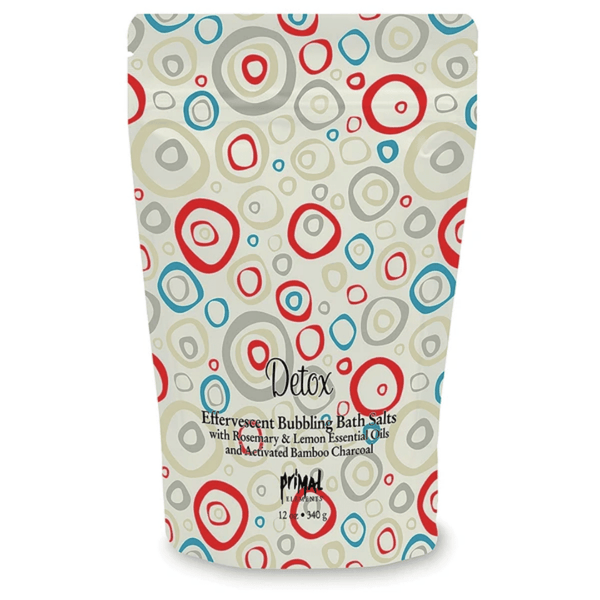 Packaging of Detox Bubbling Bath Salts | Primal Elements with colorful circular patterns in red, blue, and beige on a white background.