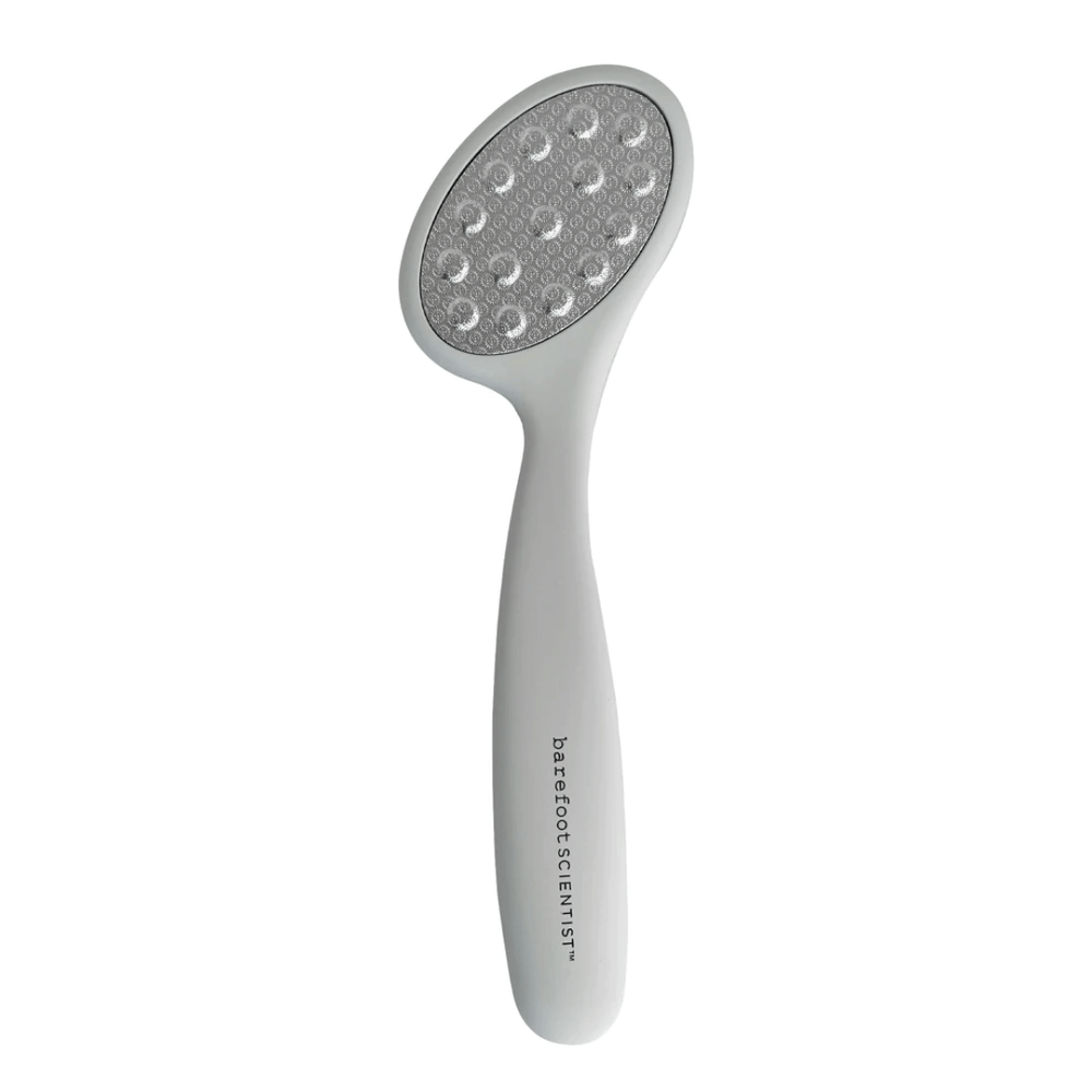 Smooth Things Over | Barefoot Scientist foot file with ergonomic white handle and textured gray abrasive surface for effective skin smoothing and care.
