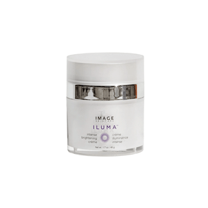 White jar of ILUMA intense brightening crème | IMAGE Skincare with a sleek silver band on the lid, designed for skincare and brightening facial wellness.