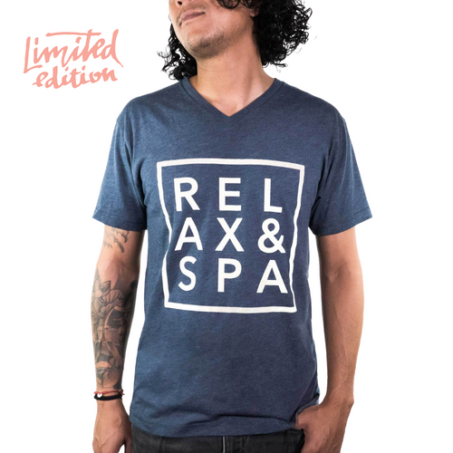 Man wearing a navy blue V-neck shirt with a white "RELAX & SPA" design inside a square, featuring "Limited Edition" text in coral, showcasing Limited Edition Promotion - Relax & Spa Unisex V-neck | Live Love Spa.
