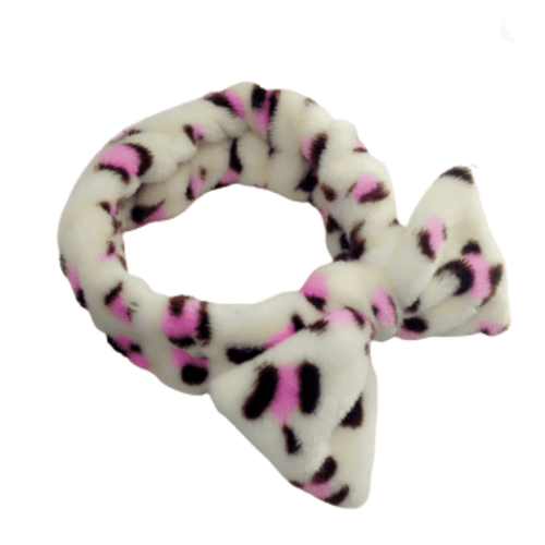Soft plush Spa Headbands | Live Love Spa in white with pink and black leopard print and a bow accent, designed for comfortable skincare and body care routines.
