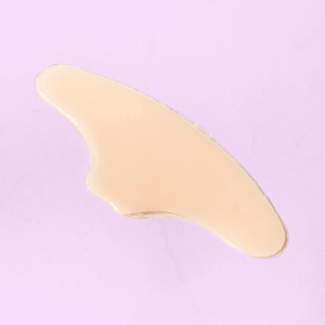 Skin Plumping Reusable Forehead Pad | Dreambox Beauty shown on a soft pink background, designed for skincare and wellness recovery tools.