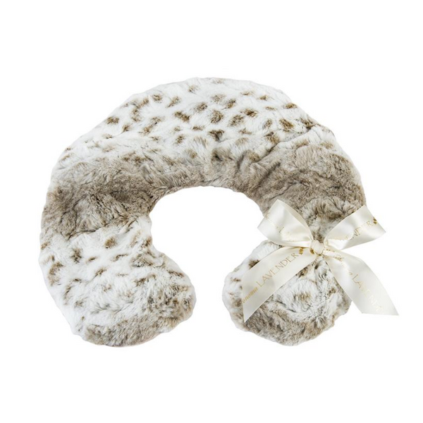 Soft plush neck pillow with Arctic circle pattern and a decorative bow, designed for comfort and relaxation, featuring the product name Neck Pillow - Arctic Circle Lavender | Sonoma Lavender.
