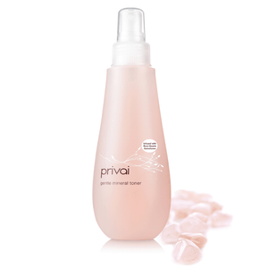Gentle Mineral Toner - Infused w/ Rose Quartz | Privai in a sleek pink bottle with rose quartz stones, promoting soothing skincare and wellness benefits.