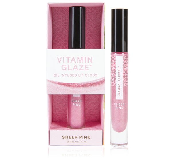 Vitamin Glaze® Oil Infused Lip Gloss – Sheer Pink | Farmhouse Fresh displayed with packaging and tube, showcasing a soft pink shimmer lip gloss for hydration and subtle color.