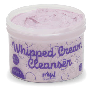Lavender Whipped Cream Cleanser | Primal Elements in a tub with a creamy lavender-colored texture, designed for gentle skincare and cleansing.