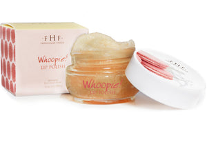 Open jar of Whoopie® Lip Polish | Farmhouse Fresh with a light exfoliating scrub texture next to its beige and pink decorative box packaging.