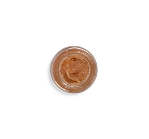 Top view of an open jar of Whoopie® Lip Polish | Farmhouse Fresh, showing the textured, sugar-based lip scrub inside designed for gentle exfoliation and lip care.
