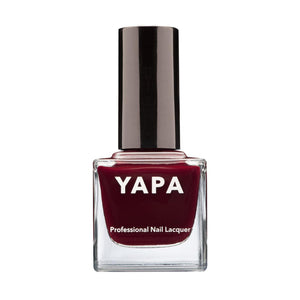 Bottle of deep red Will You Marry Me Nail Lacquer | YAPA with sleek black cap, labeled as professional nail lacquer for a polished manicure look.