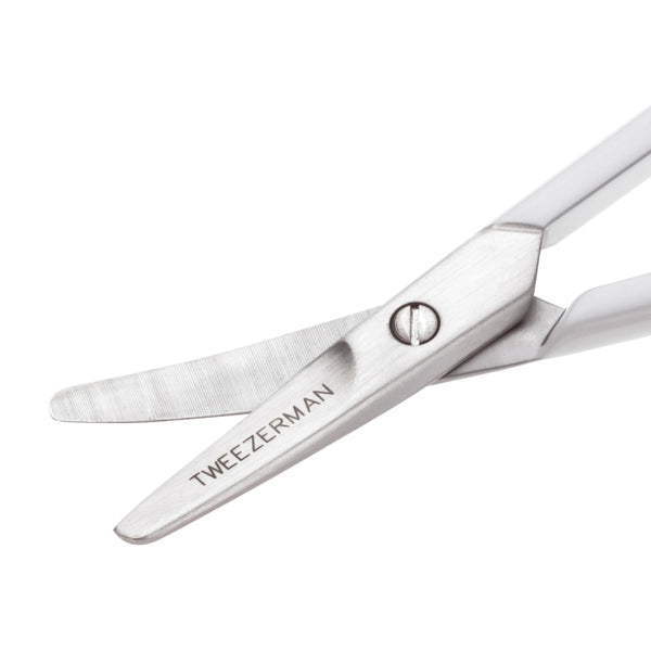 Close-up of curved stainless steel scissors from the Baby Manicure Kit | Tweezerman, designed for gentle and precise nail care for infants.