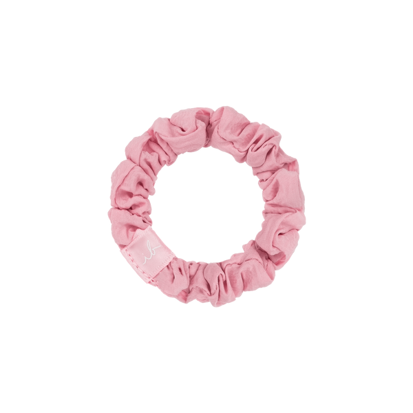Pink fabric hair tie with a scrunchie design from the LOOP 3 pc | invisibobble collection, suitable for gentle hair care and styling.