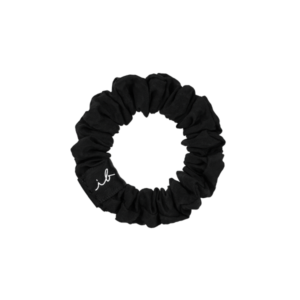 Black fabric hair scrunchie with subtle branding, designed for gentle, comfortable hold, part of the LOOP 3 pc | invisibobble collection.