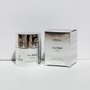 the MAX™ crème | IMAGE Skincare in reflective silver packaging alongside its matching box, both labeled with stem cell technology for advanced skincare benefits